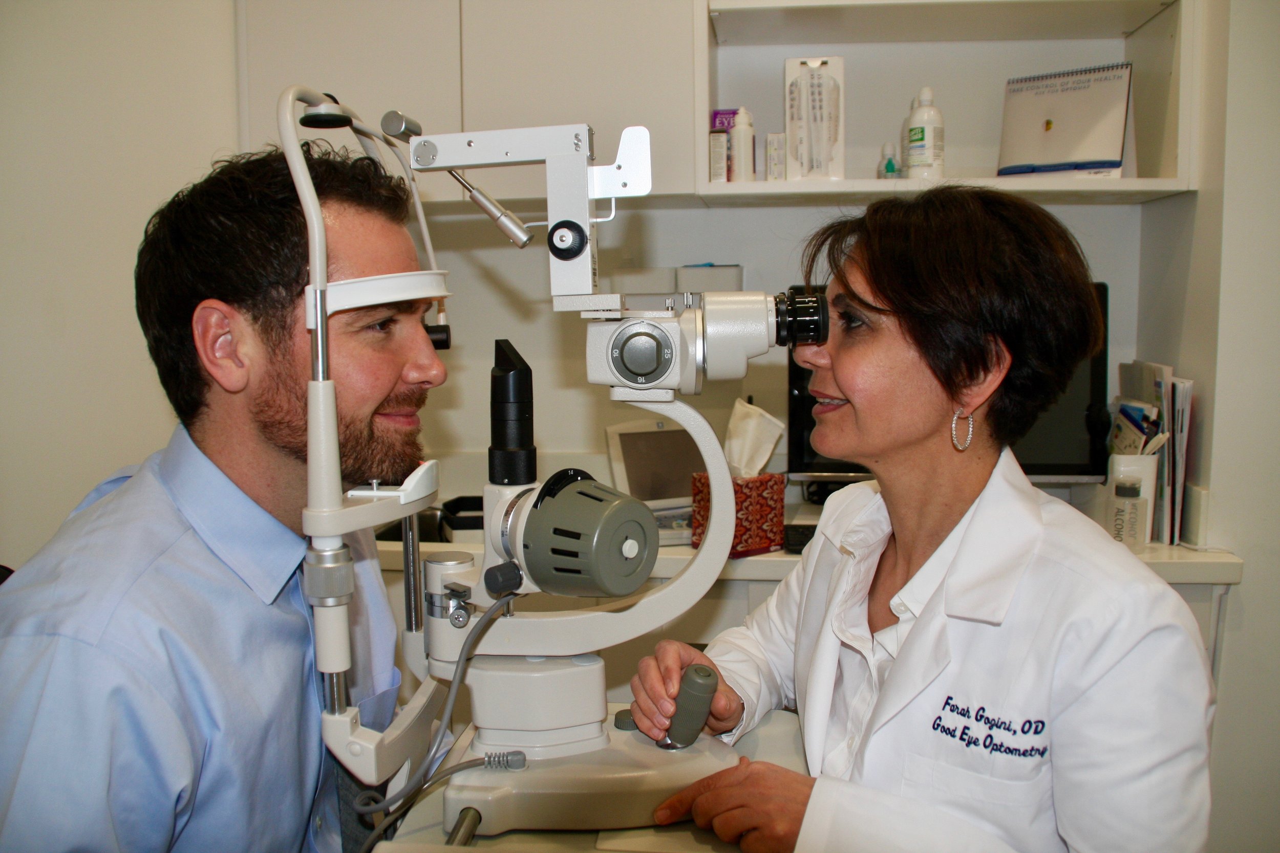Dr. Gozini administering an eye exam to a patient.